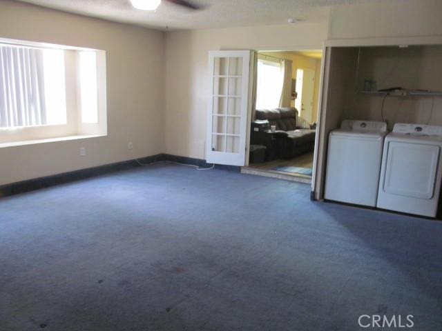 14537 Yucca St, Hesperia, CA 92345 - laundry area featuring washer and dryer, ceiling fan, dark carpet, and french doors