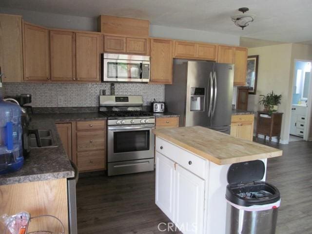 14537 Yucca St, Hesperia, CA 92345 - kitchen with stainless steel appliances, dark wood finished floors, decorative backsplash, and wooden counters