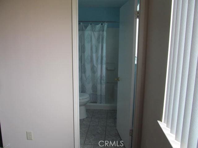 14537 Yucca St, Hesperia, CA 92345 - full bath featuring a shower stall and tile patterned flooring