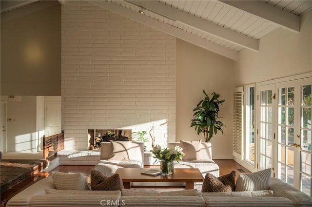9472 Rembert Ln, Beverly Hills, CA 90210 - living area with wood finished floors, high vaulted ceiling, a brick fireplace, and a wood ceiling with exposed beams