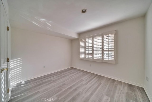 9472 Rembert Ln, Beverly Hills, CA 90210 - spare room with wood finished floors and baseboards