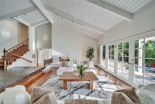 9472 Rembert Ln, Beverly Hills, CA 90210 - sunroom / solarium featuring french doors and rail lighting