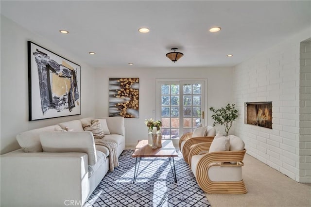 9472 Rembert Ln, Beverly Hills, CA 90210 - living area with recessed lighting, light colored carpet, and a brick fireplace
