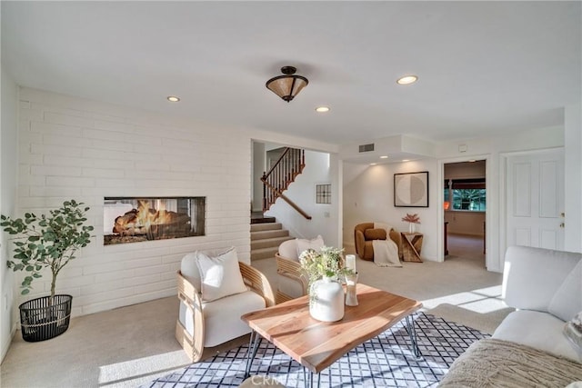 9472 Rembert Ln, Beverly Hills, CA 90210 - carpeted living room featuring stairway, a fireplace, and recessed lighting