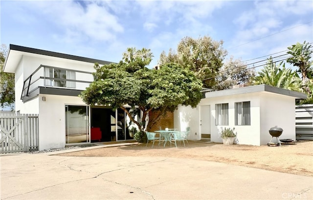 4417 E Harvey Way, Long Beach, CA 90808 - back of property featuring stucco siding and a patio