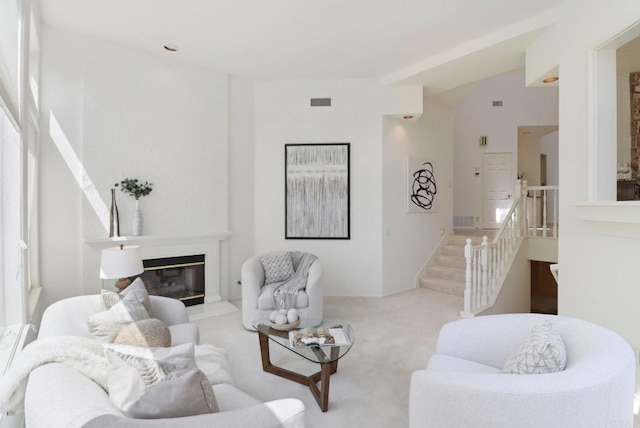 3309 Caminito Cabo Viejo, Del Mar, CA 92014 - living area with carpet, stairs, and a glass covered fireplace