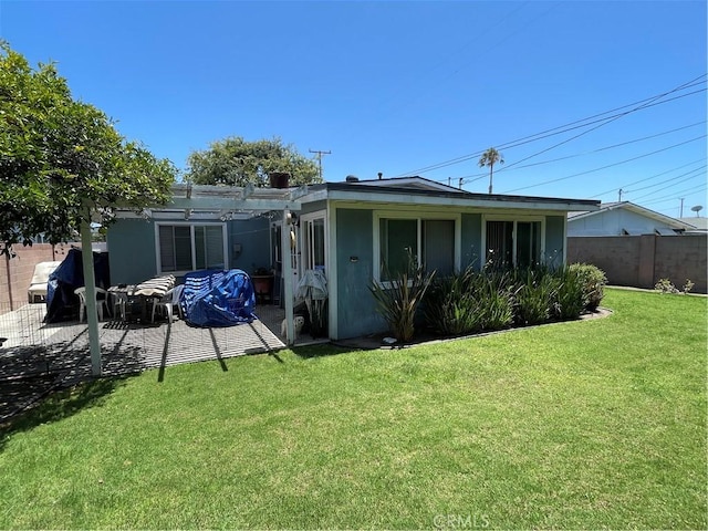 13431 Olympus Dr, Westminster, CA 92683 - back of property featuring a pergola, a patio area, and stucco siding