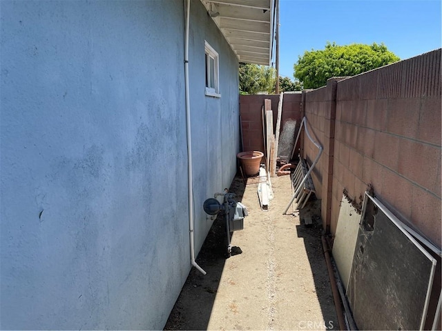 13431 Olympus Dr, Westminster, CA 92683 - view of side of property featuring a fenced backyard and stucco siding