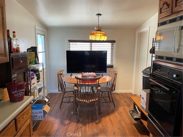 13431 Olympus Dr, Westminster, CA 92683 - dining room featuring wood finished floors and baseboards