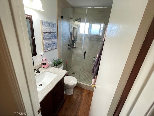 13431 Olympus Dr, Westminster, CA 92683 - bathroom with vanity, a stall shower, and wood finished floors