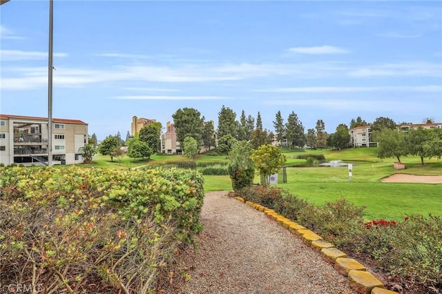 3486 Bahia Blanca W Unit 3F, Laguna Woods, CA 92637 - surrounding community featuring a lawn and view of golf course