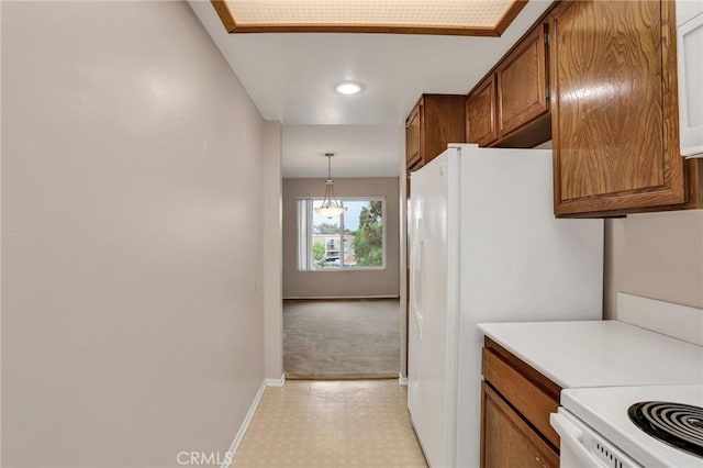 3486 Bahia Blanca W Unit 3F, Laguna Woods, CA 92637 - kitchen featuring light countertops, brown cabinetry, freestanding refrigerator, recessed lighting, and light floors