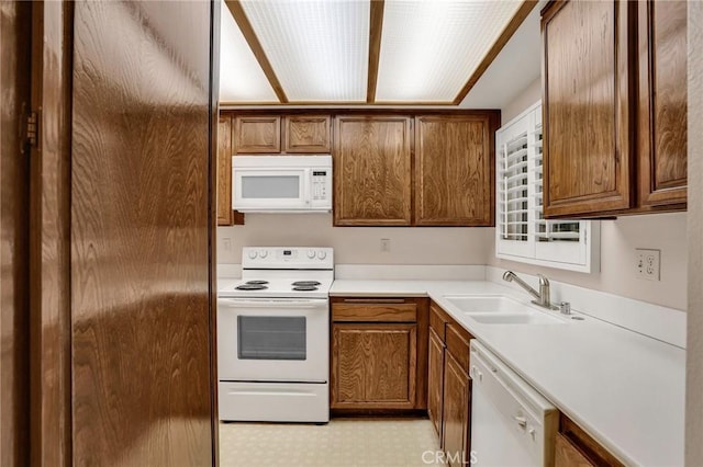 3486 Bahia Blanca W Unit 3F, Laguna Woods, CA 92637 - kitchen featuring white appliances, brown cabinets, and light countertops