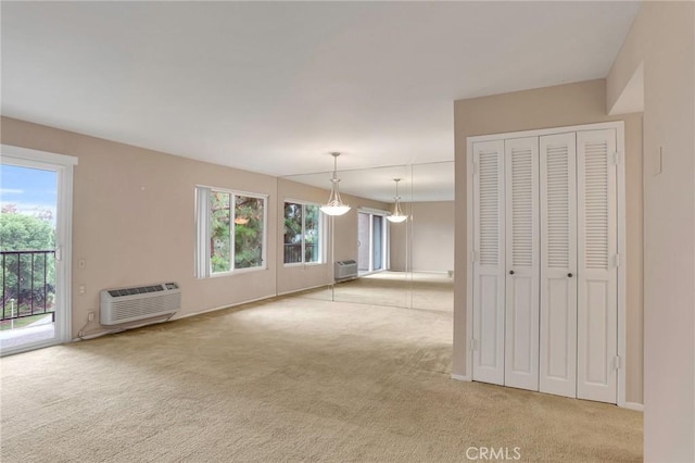 3486 Bahia Blanca W Unit 3F, Laguna Woods, CA 92637 - unfurnished living room with carpet floors and an AC wall unit