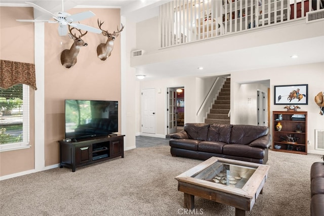 24825 Florence Ave, Corning, CA 96021 - carpeted living area with a towering ceiling, stairway, and a ceiling fan