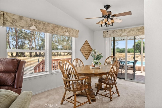 24825 Florence Ave, Corning, CA 96021 - dining space featuring vaulted ceiling, light colored carpet, and a ceiling fan