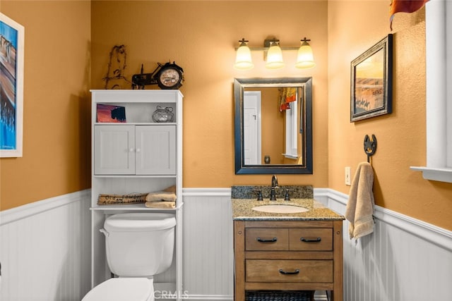 24825 Florence Ave, Corning, CA 96021 - half bathroom featuring wainscoting and vanity