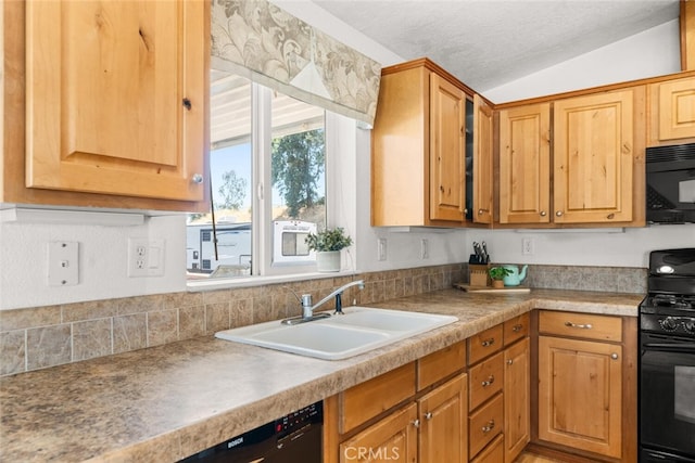 24825 Florence Ave, Corning, CA 96021 - kitchen with black appliances, light countertops, lofted ceiling, and a textured ceiling