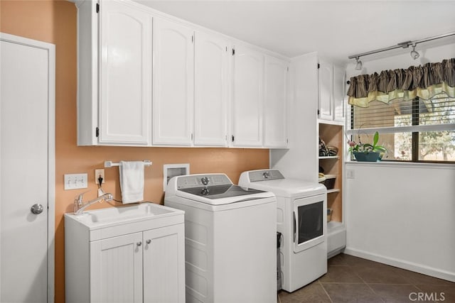 24825 Florence Ave, Corning, CA 96021 - laundry room featuring independent washer and dryer, cabinet space, dark tile patterned flooring, and track lighting