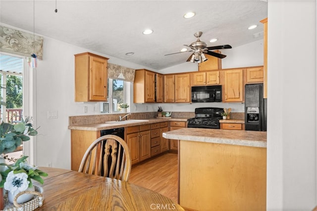 24825 Florence Ave, Corning, CA 96021 - kitchen with black appliances, recessed lighting, lofted ceiling, light countertops, and ceiling fan
