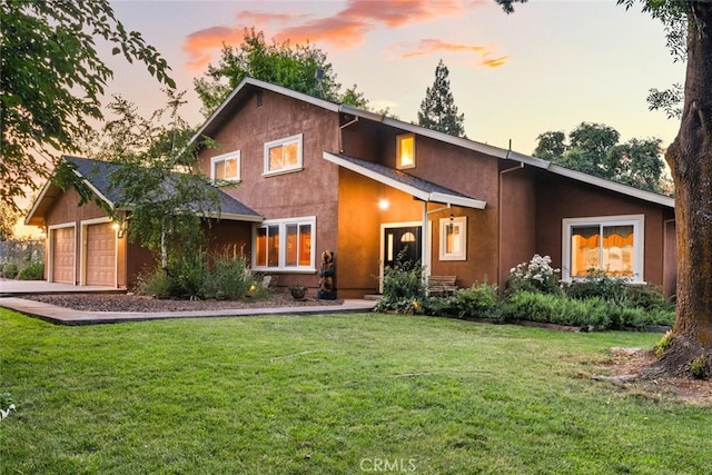24825 Florence Ave, Corning, CA 96021 - view of front of home featuring stucco siding, a garage, a front lawn, and concrete driveway