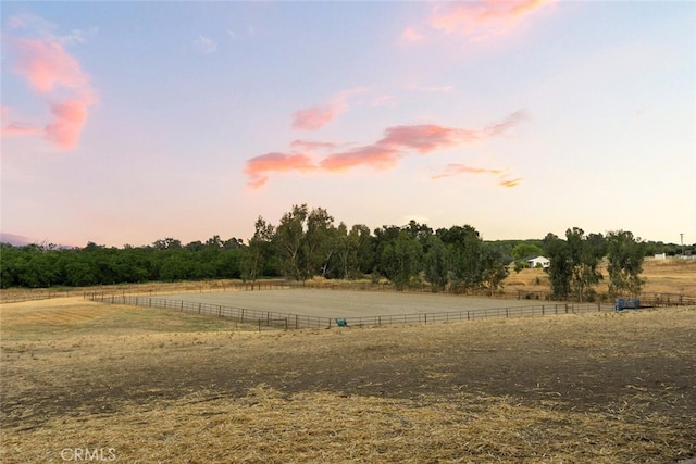 24825 Florence Ave, Corning, CA 96021 - yard at dusk with a view of rural / pastoral area and an outdoor riding arena