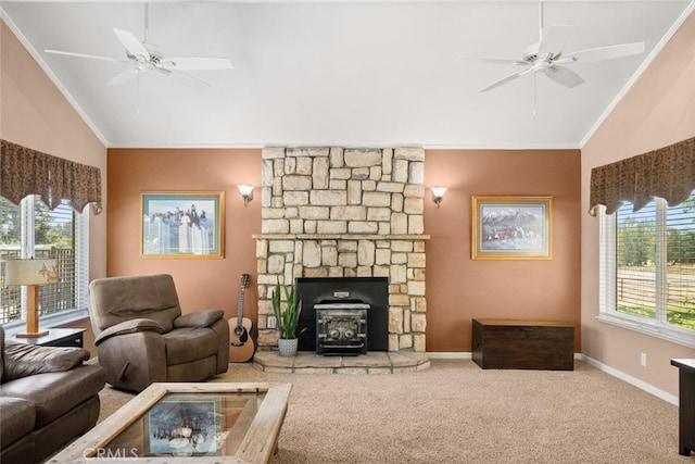 24825 Florence Ave, Corning, CA 96021 - carpeted living room with ceiling fan, healthy amount of natural light, a wood stove, crown molding, and high vaulted ceiling
