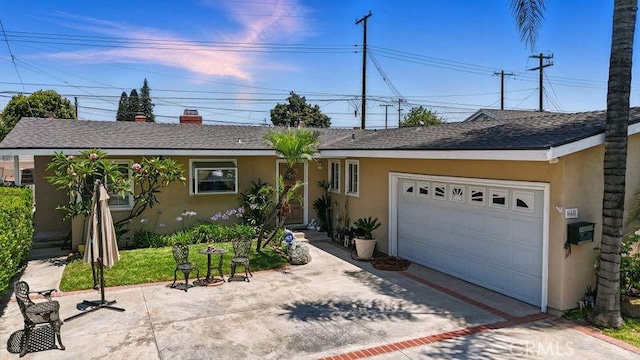 665 N Waterbury Ave, Covina, CA 91722 - ranch-style home with stucco siding, a garage, and concrete driveway