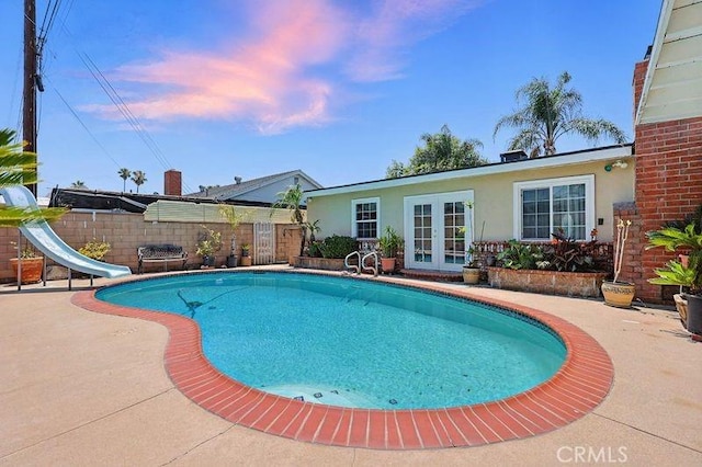 665 N Waterbury Ave, Covina, CA 91722 - view of pool with french doors, a water slide, and a patio area