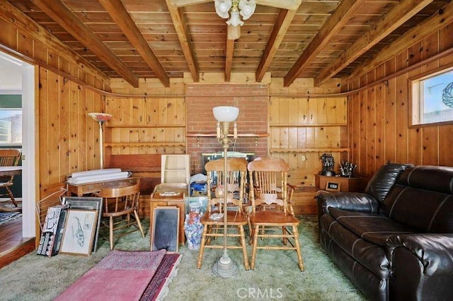 665 N Waterbury Ave, Covina, CA 91722 - carpeted living room featuring wood walls and a wooden ceiling with exposed beams