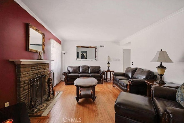 665 N Waterbury Ave, Covina, CA 91722 - living area with light wood-style flooring, a fireplace, and crown molding
