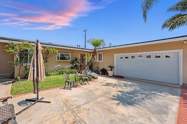 665 N Waterbury Ave, Covina, CA 91722 - ranch-style house featuring stucco siding, concrete driveway, and an attached garage