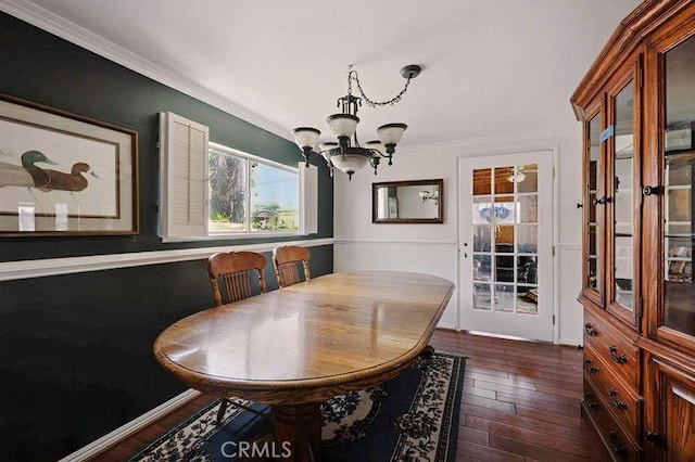 665 N Waterbury Ave, Covina, CA 91722 - dining area with a chandelier, dark wood-type flooring, and ornamental molding