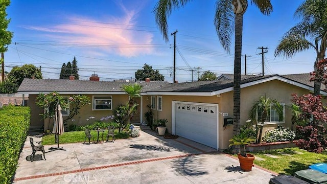 665 N Waterbury Ave, Covina, CA 91722 - ranch-style house with stucco siding, a garage, and driveway