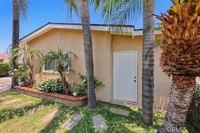 665 N Waterbury Ave, Covina, CA 91722 - property entrance featuring stucco siding