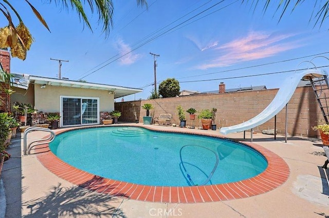 665 N Waterbury Ave, Covina, CA 91722 - view of swimming pool featuring a water slide, a fenced backyard, and a patio