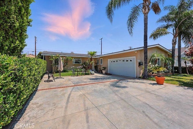 665 N Waterbury Ave, Covina, CA 91722 - single story home with stucco siding, driveway, and a garage
