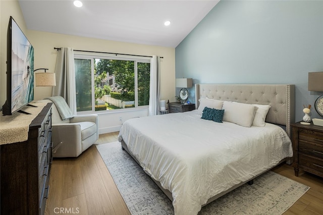 20 Marigold Unit 15, Irvine, CA 92614 - bedroom featuring vaulted ceiling, recessed lighting, and wood finished floors