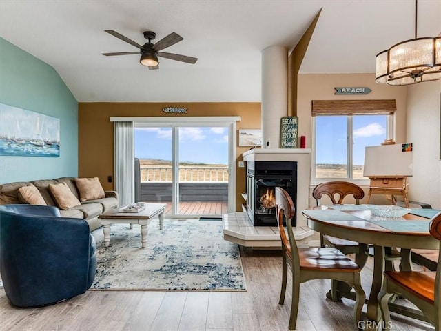 271 Vista Del Mar Unit 1, San Simeon, CA 93452 - living room with lofted ceiling, ceiling fan, wood finished floors, healthy amount of natural light, and a glass covered fireplace