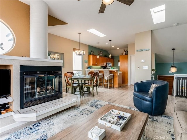 271 Vista Del Mar Unit 1, San Simeon, CA 93452 - living area with a skylight, ceiling fan, light wood-style floors, and ornate columns