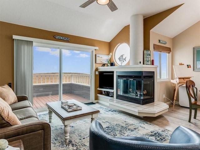 271 Vista Del Mar Unit 1, San Simeon, CA 93452 - living room featuring vaulted ceiling, ceiling fan, and wood finished floors
