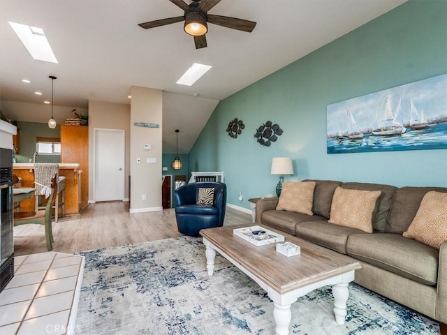 271 Vista Del Mar Unit 1, San Simeon, CA 93452 - living area featuring a skylight, wood finished floors, vaulted ceiling, and ceiling fan