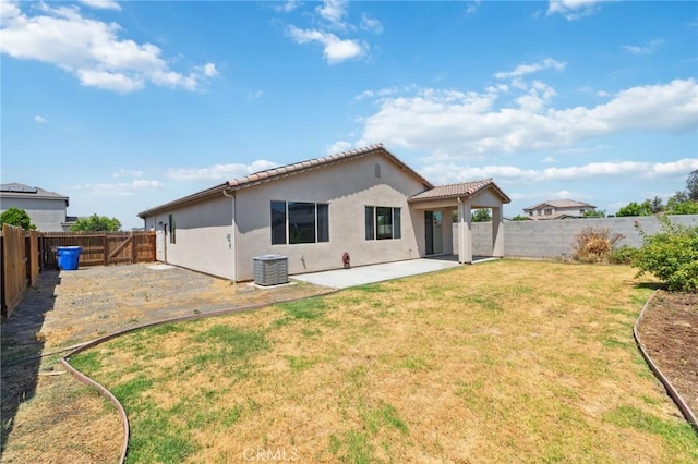 843 Sydney Way, Lemoore, CA 93245 - rear view of house with a patio, a fenced backyard, stucco siding, and a tiled roof