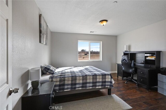 7755 7th St, Phelan, CA 92371 - bedroom featuring wood finished floors and a textured ceiling