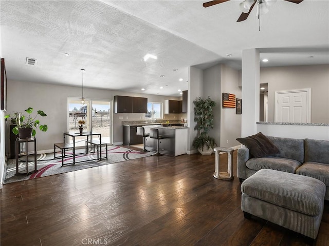 7755 7th St, Phelan, CA 92371 - living room with ceiling fan, dark wood-style floors, and recessed lighting