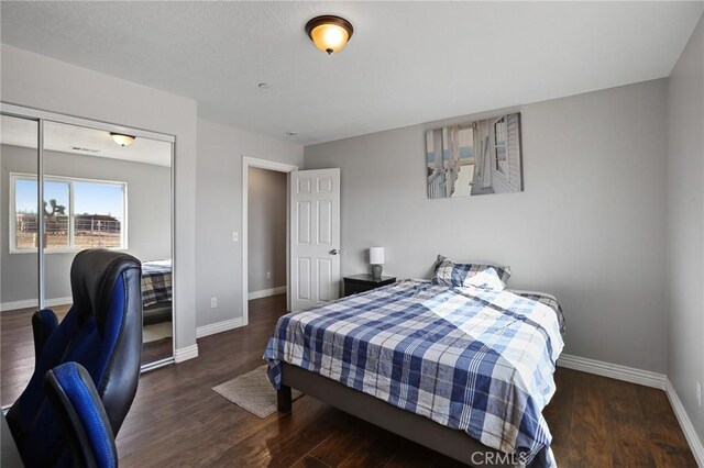 7755 7th St, Phelan, CA 92371 - bedroom with wood finished floors and a closet