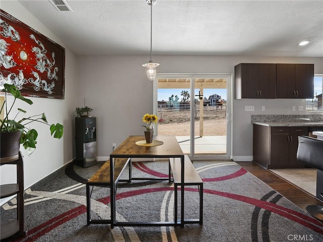 7755 7th St, Phelan, CA 92371 - dining space with recessed lighting, dark wood-style flooring, and a textured ceiling
