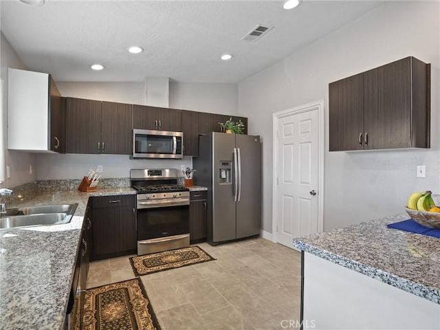 7755 7th St, Phelan, CA 92371 - kitchen with stainless steel appliances, dark brown cabinets, and recessed lighting