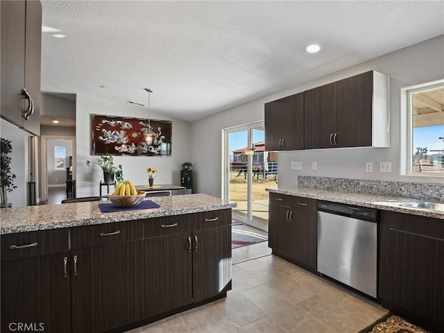7755 7th St, Phelan, CA 92371 - kitchen with stainless steel dishwasher, dark brown cabinetry, lofted ceiling, pendant lighting, and light tile patterned floors