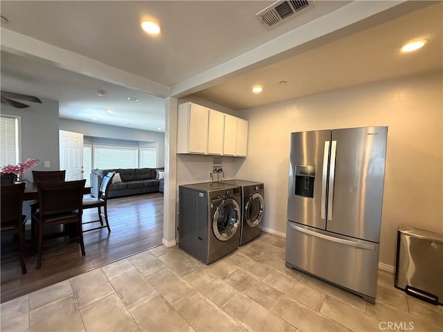 13906 S Kalsman Ave, Compton, CA 90222 - kitchen with stainless steel fridge, washer and dryer, white cabinetry, recessed lighting, and light tile patterned floors